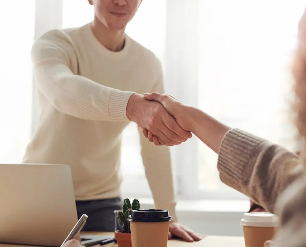 Man and woman shaking hands